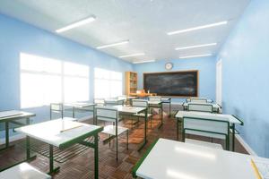 Interior of sunlit classroom with chalkboard. 3d render photo