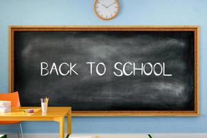 3D illustration. Back to school text written on a blackboard in the classroom. photo