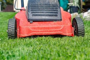 lawnmower in a meadow photo