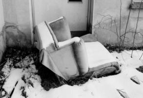 Old armchair in the snow photo