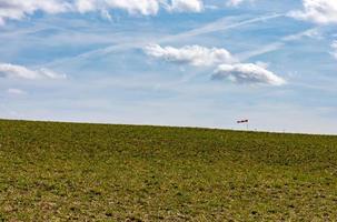 green meadow in spring with a windsock photo