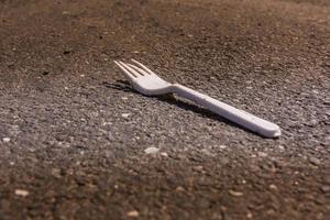 a plastic fork on a street photo