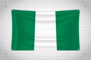 Nigeria flag hanging on brick wall. 3D drawing. Flag attached to the wall. Neatly drawing in groups on separate layers for easy editing. vector