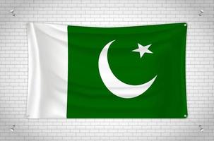 Pakistan flag hanging on brick wall. 3D drawing. Flag attached to the wall. Neatly drawing in groups on separate layers for easy editing. vector