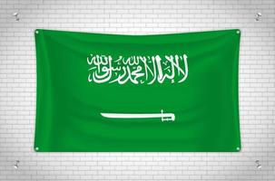 bandera de arabia saudita colgada en la pared de ladrillo. dibujo 3d bandera pegada a la pared. dibujar cuidadosamente en grupos en capas separadas para facilitar la edición. vector