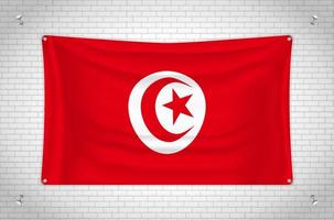 Tunisia flag hanging on brick wall. 3D drawing. Flag attached to the wall. Neatly drawing in groups on separate layers for easy editing. vector