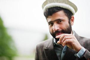 Beard afghanistan man wear pakol hat and jacket. photo