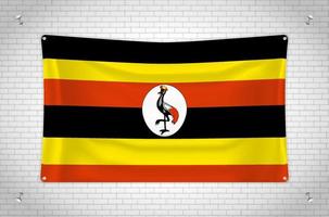 Uganda flag hanging on brick wall. 3D drawing. Flag attached to the wall. Neatly drawing in groups on separate layers for easy editing. vector