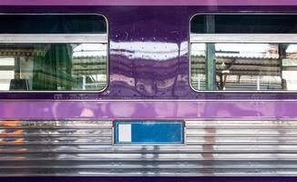 Side view of the stainless passenger car. photo