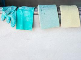 Sponge pad and rubber glove are drying. photo