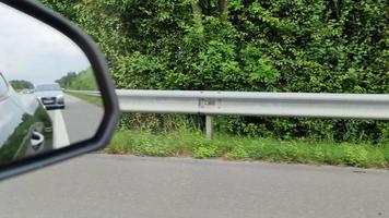 Motion blurred view out of the side window of a driving car on a highway in germany video