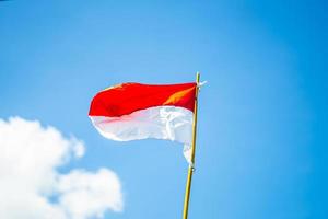 Indonesian flag with sky background photo