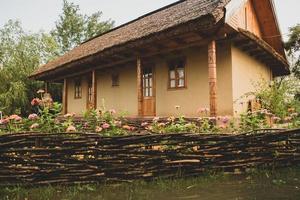 rural house made of clay and clay roof. The ideal country house for rest and relaxation in the bosom of nature photo