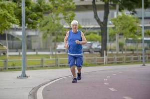 Senior walking in street photo