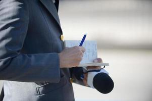 report writting in a notebook photo