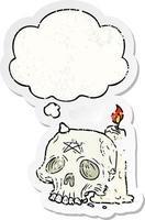 cartoon spooky skull and candle and thought bubble as a distressed worn sticker vector