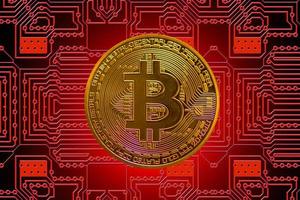 bitcoin único valioso dorado de moneda criptográfica con un tablero rojo en el medio de fondo foto