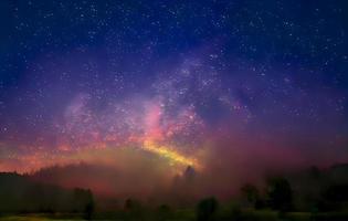 Night landscape with colorful Milky Way and mountains. Starry sky with hills at summer. Beautiful Universe. Space background photo