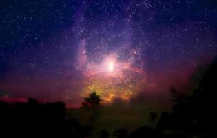 Night landscape with colorful Milky Way and mountains. Starry sky with hills at summer. Beautiful Universe. Space background photo
