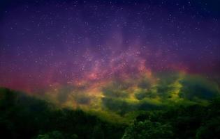 Night landscape with colorful Milky Way and mountains. Starry sky with hills at summer. Beautiful Universe. Space background photo
