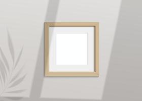 Realistic vector mockup with wooden photo frame. Shadow on the wall and empty place for your design. 3d soft light and overlay shadow from leaves of plant and window. Square poster or painting.