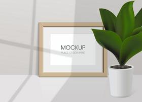 Realistic vector mockup with photo frame and plant leaves. Shadow on the wall and empty place for your design. 3d soft light and overlay shadow from plant and window. Realistic illustration mock up.