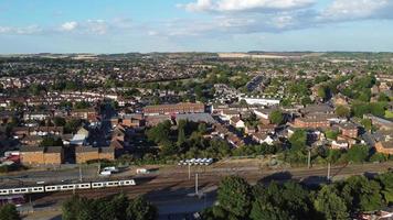 Aerial view of British Town Centre of Luton England with Railway Station and Train on Track video