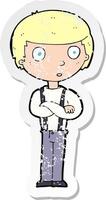 retro distressed sticker of a cartoon staring boy with folded arms