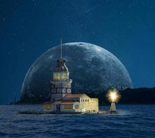 Maiden's Tower and Istanbul silhouette in the moonlight photo