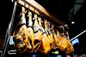 Traditional spanish jamon ham for sale at supermarket. photo