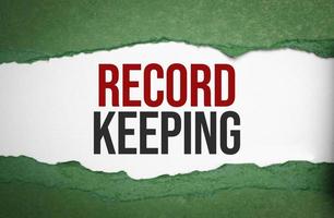 RECORD KEEPING text on green torn paper photo