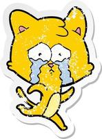 distressed sticker of a cartoon crying cat vector