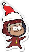 happy astronaut sticker cartoon of a wearing santa hat vector