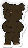 sticker of a cartoon happy little black bear vector