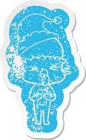 disgusted cartoon distressed sticker of a alien wearing santa hat vector