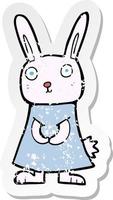 retro distressed sticker of a cartoon rabbit vector