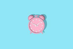 Alarm clock vintage rendering 3D. Pink alarm clock isolated on a blue background. photo