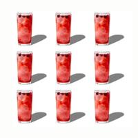 A pattern of glasses with berry lemonade isolated on a white background. The concept of summer drinks. photo