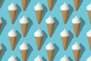 Seamless pattern of white ice creams isolated on blue background. Pattern design for banner, poster, flyer, card, postcard, cover, brochure. Many white ice creams with shadow rendering 3D. photo