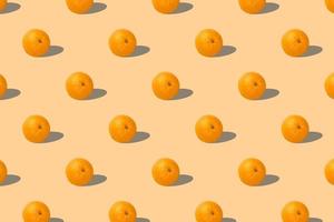 Fruit pattern of fresh oranges 3d render on yellow background. Pop art design, creative summer concept. Set. Seamless texture pattern. 3D illustration. photo