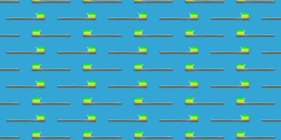 Seamless pattern of wooden tooth brushes isolated on blue background. Green toothpaste on toothbrush. photo