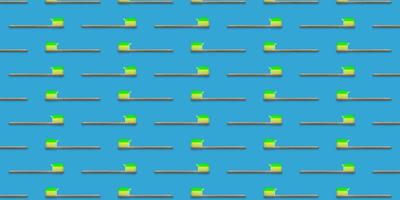 Seamless pattern of wooden tooth brushes isolated on blue background. Green toothpaste on toothbrush. photo