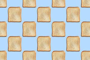 Seamless pattern with crispbread on blue background. photo