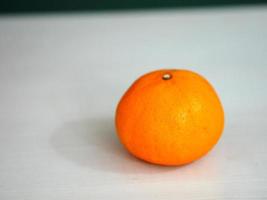 Orange fruit on white background photo