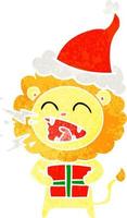 retro cartoon of a roaring lion with gift wearing santa hat vector