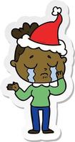 sticker cartoon of a crying woman wearing santa hat vector