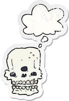 cartoon spooky skull and thought bubble as a distressed worn sticker vector