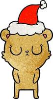 peaceful textured cartoon of a bear wearing santa hat vector