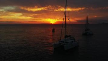 Aerial ocean view of yachts at sunset video