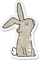 distressed sticker of a cartoon rabbit vector